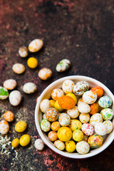 multicolored candy jelly beans caramel in the shape of small Easter eggs