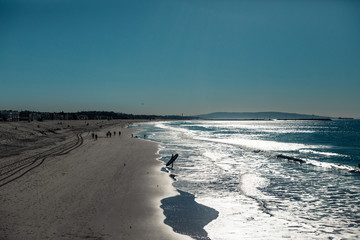 beach and sea. surfer walking on the beach. Ocean. LA. California. Morning. 