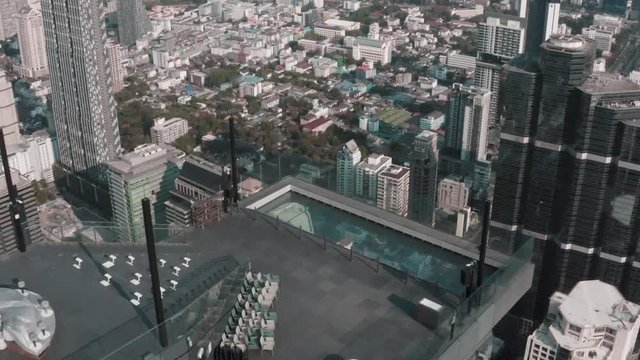 Aerial view of Sathorn district, Chong Nonsi, King Power Mahanakhon tower and skywalk in Bangkok, Thailand
