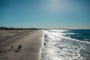 footprints in the sand. surfer walking on the beach. Ocean. LA. California. Morning.