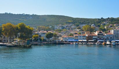 Fototapeta na wymiar Boats line the waterfront of Burgazada, one of the Princes' Islands, also called Adalar, in the Sea of Marmara off the coast of Istanbul