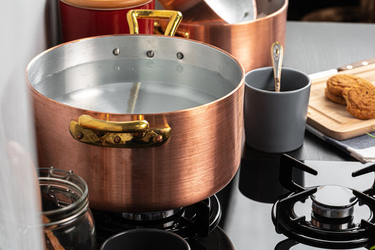 Copper Pot With Boiling Water On A Gas Stove Close Up