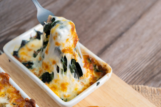 Spinach Baked Cheese With Gooey Cheese, Wooden Table.