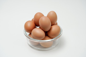 Eggs in a transparent glass bowl. A bowl of eggs