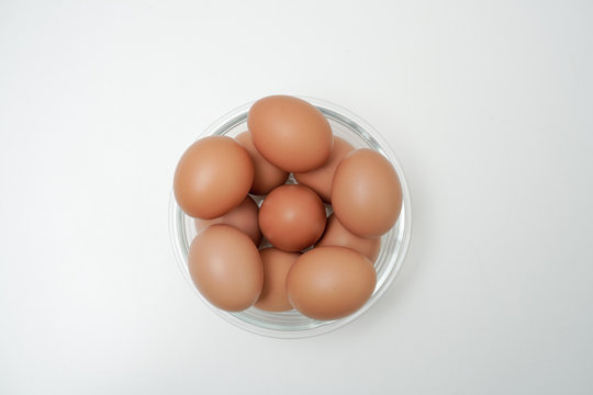 Eggs in a transparent glass bowl. A bowl of eggs