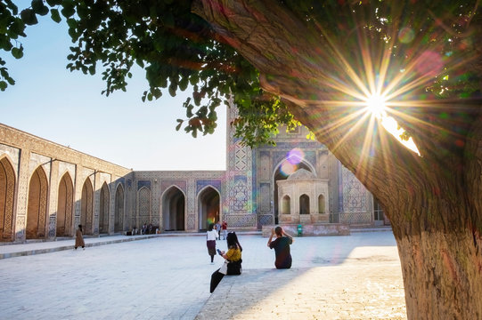 Inner yard of Kalyan Mosque, part of the Po-i-Kalyan Complex, at the sunset. Bukhara, Uzbekistan