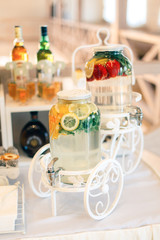 Fototapeta na wymiar Beautiful handmade fresh lemonade bottles on a table 