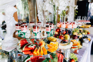 Set of desserts on buffet,jelly, candies,macarons