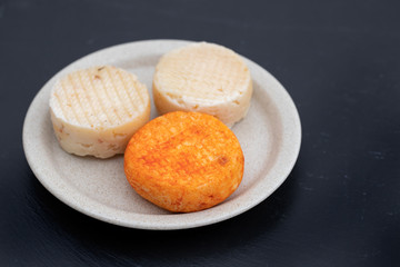 various cheese on gray ceramic background
