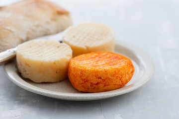 various cheese on gray ceramic background