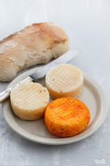 various cheese on gray ceramic background