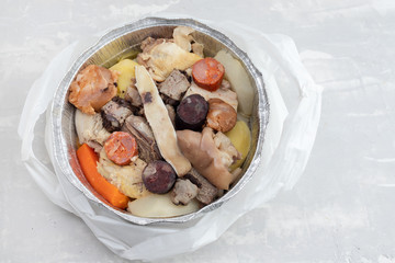 typical portuguese dish cozido a portuguesa in plastic box take away
