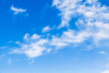 Naklejka na ściany i meble White altocumulus clouds in a blue sky at daytime