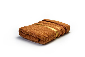Fototapeta na wymiar clean, soft brown towel on a white background, bathroom, hygiene