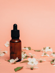 Glass bottles with oil, perfume. Spa. cosmetics. Blooming cherry.