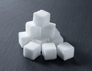 Sugar cubes placed on a black background