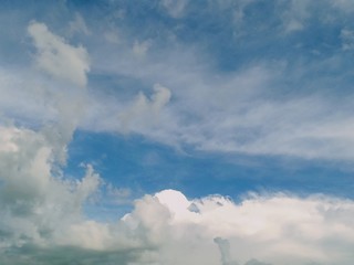 black and white clouds with blue sky