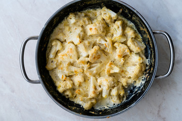 Roasted Cauliflower with Cream, Milk and Cheddar Cheese in Pan Pot / Healthy Organic Vegetarian Food.
