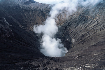 Photo of smoke volcano crater on Java island