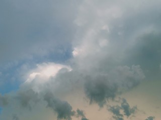 black and white clouds with blue sky