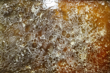 Drops of fat and oil on oven baking tray, texture and background