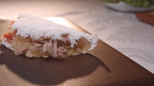 Brazilian tapioca with tuna, tomato and onion