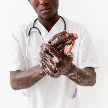 Professional Black Young Doctor Washing Hands Close-up