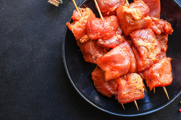 raw meat pork or beef in a plate on the table (preparing healthy food, marinade and spices paprika) menu concept background. top view. copy space for text