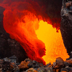 Eruption of Volcano Tolbachik, boiling magma flowing through lava tubes under the layer of solid...