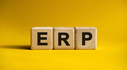 ERP text on wooden cubes on a yellow background