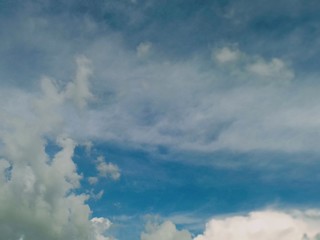black and white clouds with blue sky