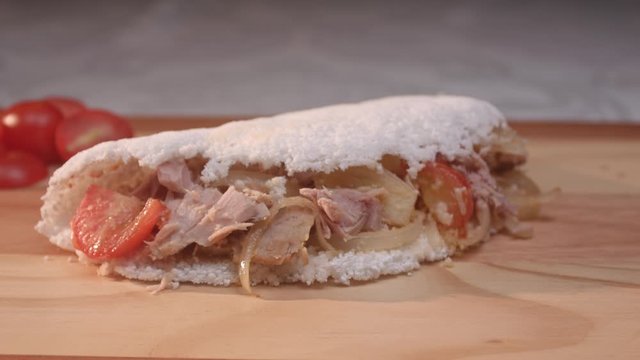 Brazilian tapioca with tuna, tomato and onion