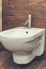 White mounted toilet bidet in modern bathroom