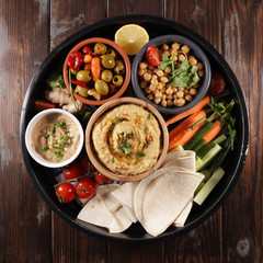 platter of hummus, olive, bread