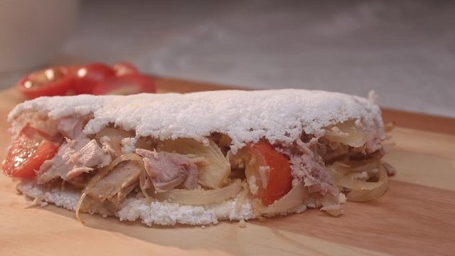 Brazilian tapioca with tuna, tomato and onion
