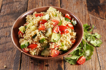 pasta salad with tomato, cucumber and parsley