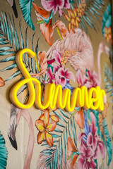 Fototapeta premium Summer neon sign on colorful tropic style wall.