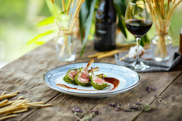Gourmet herb-crusted lamb chopswith wilted spinach