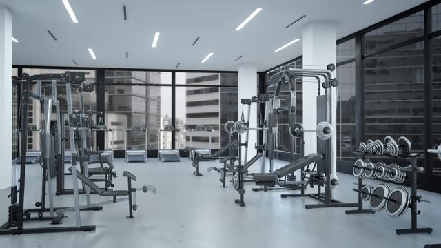 Empty gym interior with sports equipment, heavy gym equipment arranged inside modern fitness club.