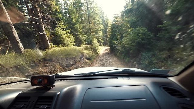 Driving off-road old-fashioned vehicle. Driving old-fashioned off-road Smooth footage from offroad vehicle driving up a mountain. Slow motion.