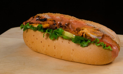 Crispy Chicken Cola Turkey with Lettuce And Tomato Served on Wooden Table Dark Background