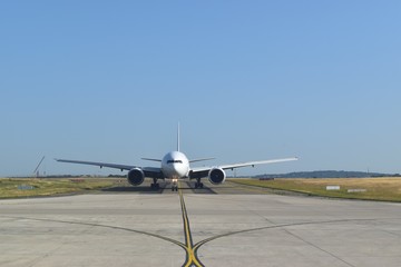 Commercial plane ready to take-off, front view.
Aviation industry background.
