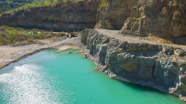 Quarry with beautiful blue water in it. Aerial view from drone