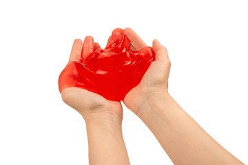 Red slime toy in woman hand isolated on white.