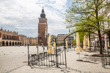 Almost empty Krakow Market Square in the time of pandemia (Coronavirus - Covid-19).  Empty restaurants without people 