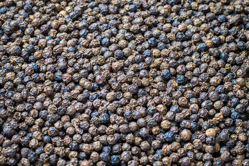 Black peppercorns for background , dry organic product in Thailand , spice in use cooking