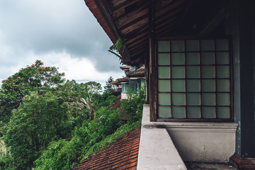 abandoned building with balcony, glass windows