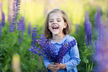 little girl with flowers smile