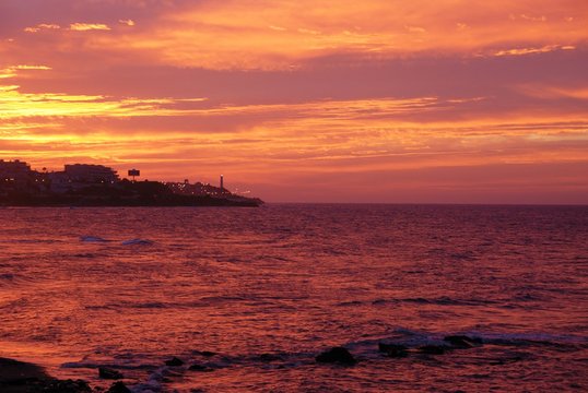 Sunrise over the Costa del Sol coast near Fuengirola, Mijas Costa, Andalusia, Spain.