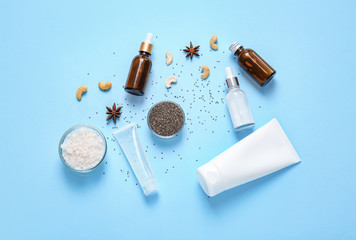 Natural cosmetics with ingredients on color background